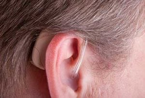 Man-with-RIC-Hearing-Aid-UCI-Audiology