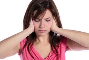Woman-Frustrated-with-Tinnitus-UCI-Audiology