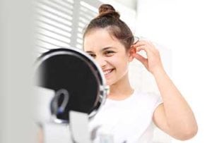 Young-Girl-Trying-ITC-Hearing-Aids-UCI-Audiology