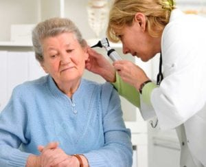 Audiologist Shaking Hands with Happy Patient